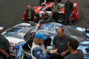 Cindi debriefs crew chief and lead mechanic